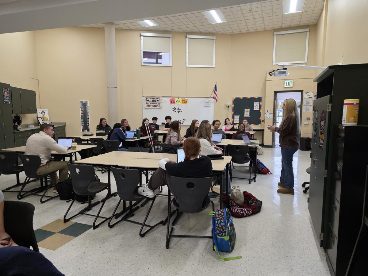 Student Council members carefully listened to President Kathryn Haas, who was discussing upcoming events. 