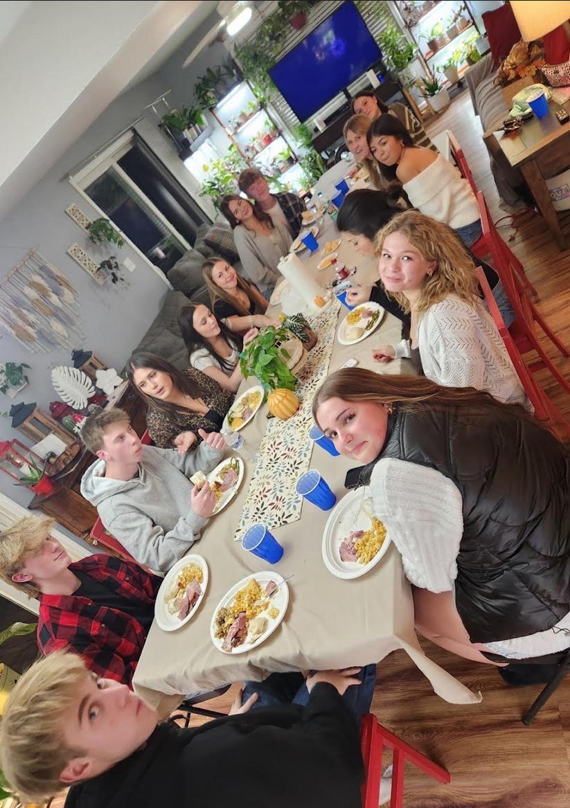 Maddy and her friends enjoying a nice, home cooked Thanksgiving meal. 