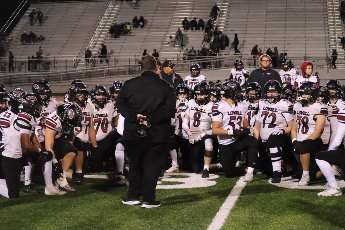 Coach Casey McKim talks to his team after the sectional championship games against Hobart.