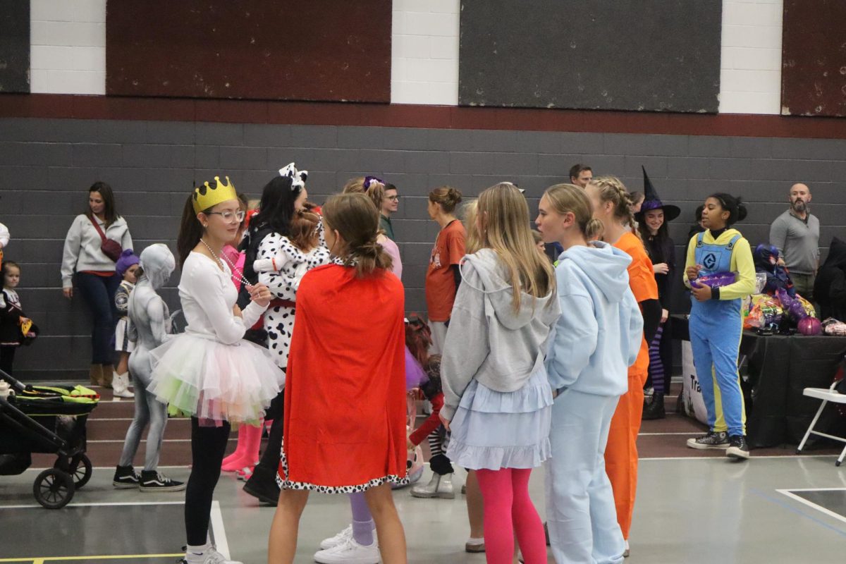 Girls Cross Country passing out candy at this year's Track or Treat.