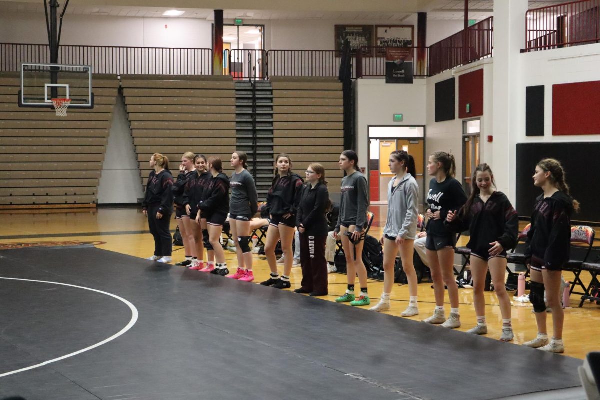 The Girls Wrestling Team waits to wrestle Griffith, hoping for a win. 