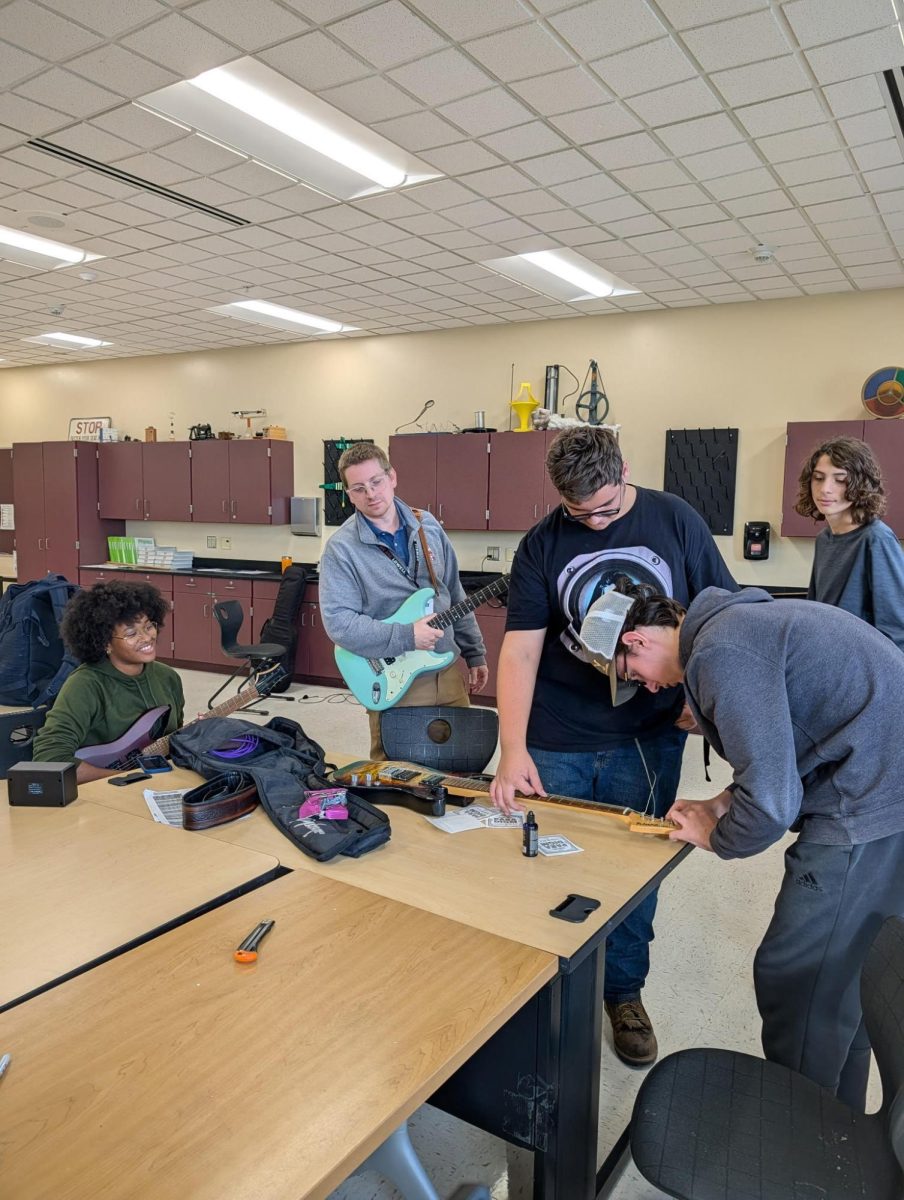 The Guitar Club working together at one of their meetings!