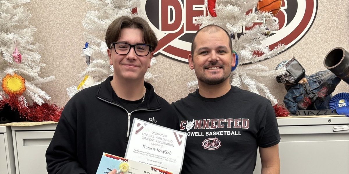 Mason Umfleet and Mr. Martinez pose for a picture to celebrate Mason’s success. 