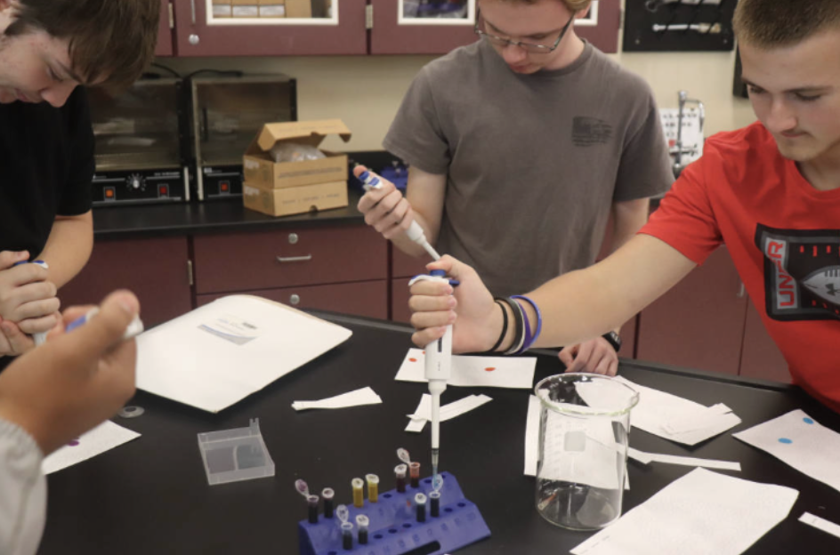 Students use the pipettes to transfer liquids. The hands on learning allows them to learn greatly!