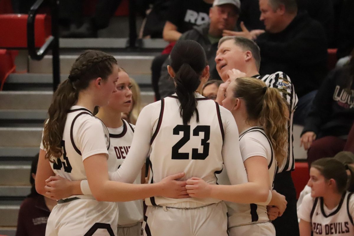 The team gathers for a talk during the timeout.