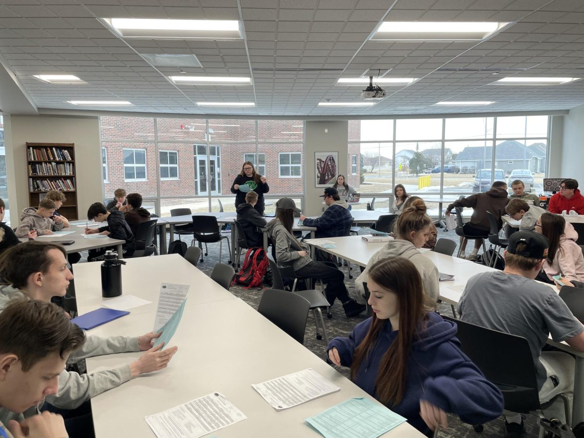 Mr. Martinez's fourth period English 9 class listens to Ms. Fitzsimons, one of our school counselors, discuss graduation requirements with them.