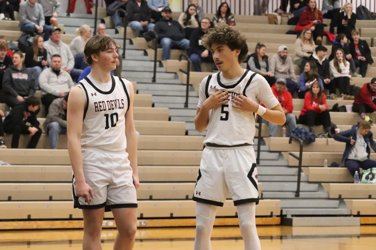 Senior Tyler Fredrickson and Sophomore Aiden Hernandez communicate during a dead ball.