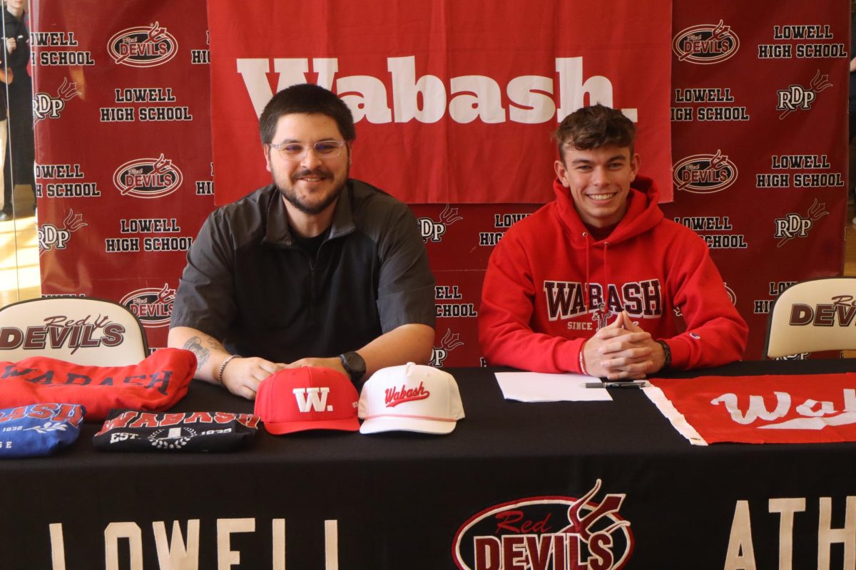Coach Mahar and senior Camden Mikulich, as Camden prepares to sign with Wabash.