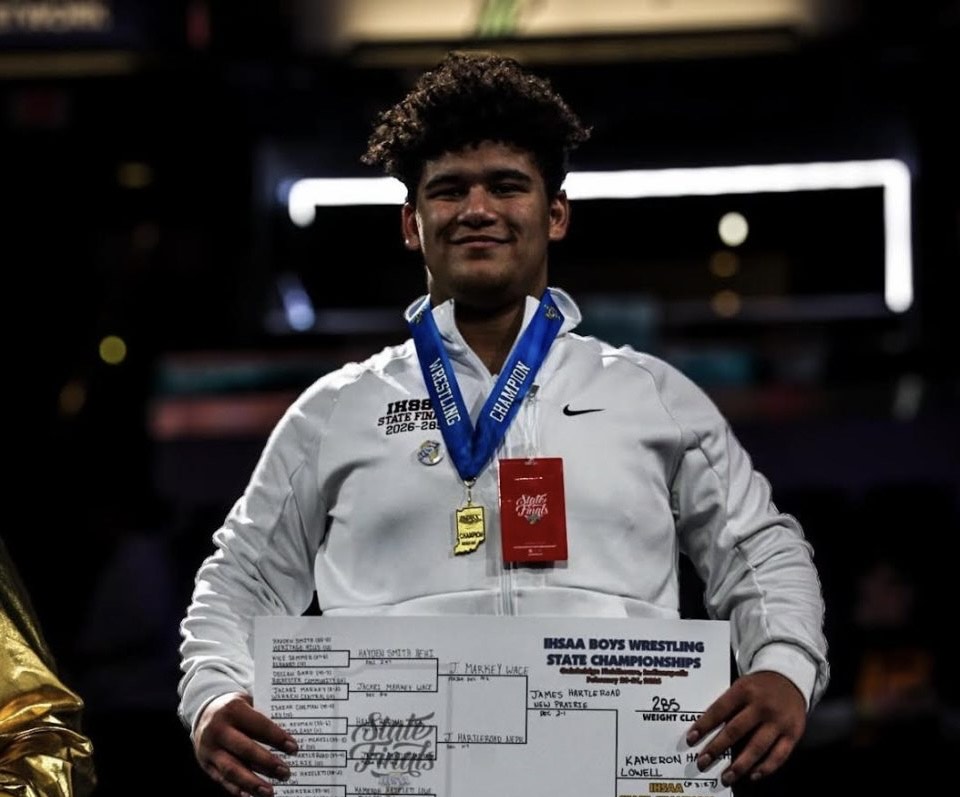 Sophomore Kameron Hazelett stands on top of the podium after winning his second state title. 