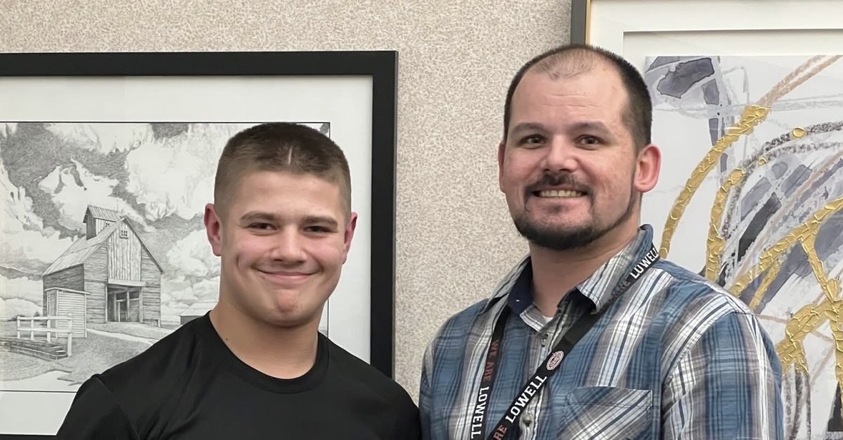 Mr Martinez and freshman Brett Schmelter pose for a photo after Brett is awarded Student of the Month.