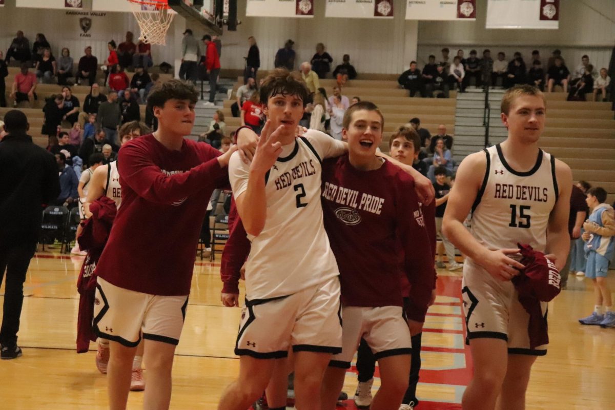 Senior Roan Vasko celebrates with his team after the big sectional win against River Forest.