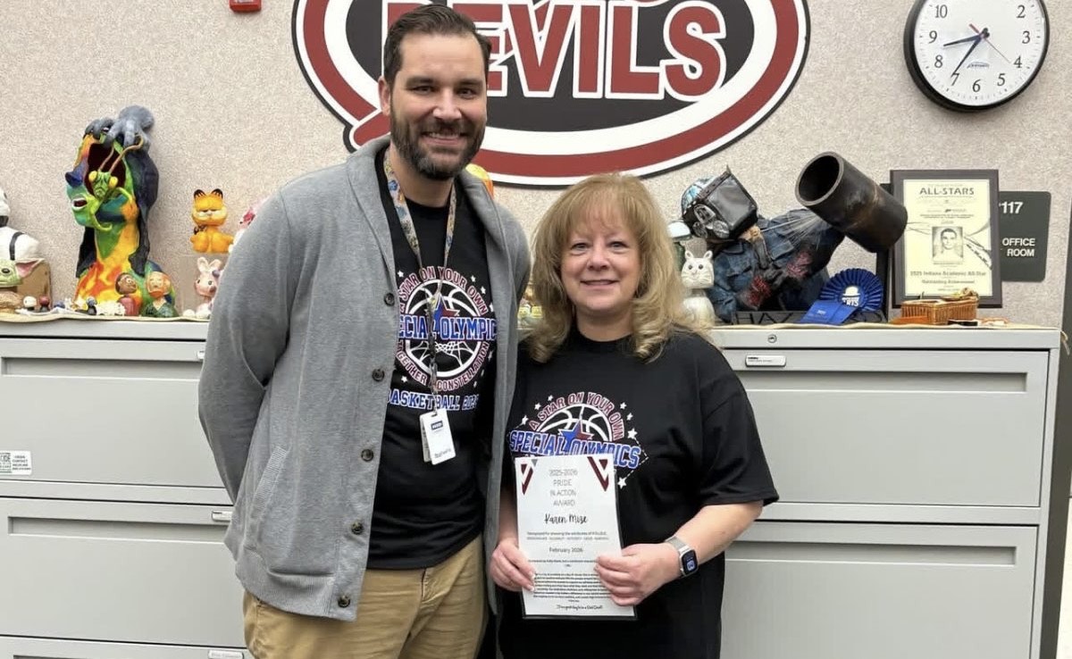 Mrs. Mize poses with LHS principal, Mr. Goeringer.