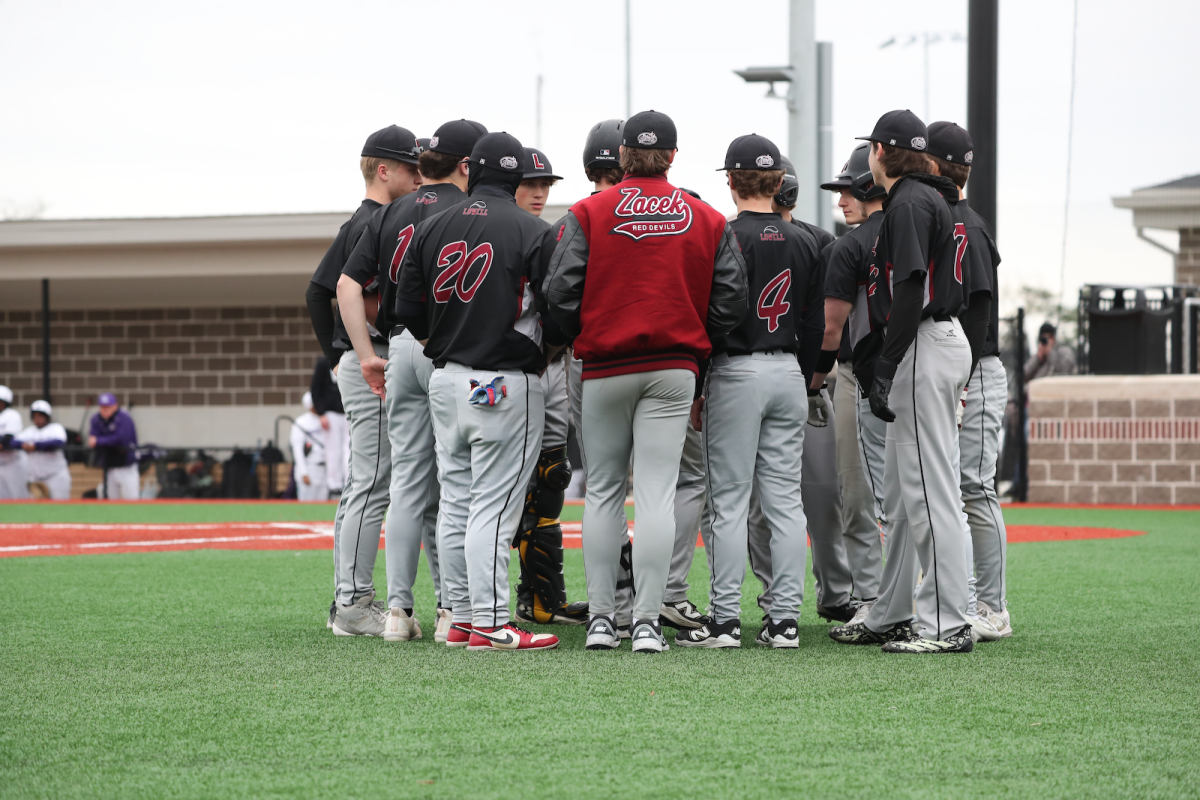 Red Devils Baseball Squad huddled up.