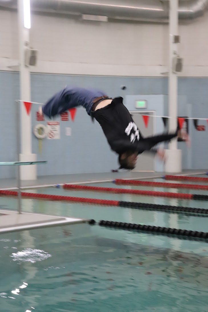 Mr. Govert attempts a backflip into the pool.