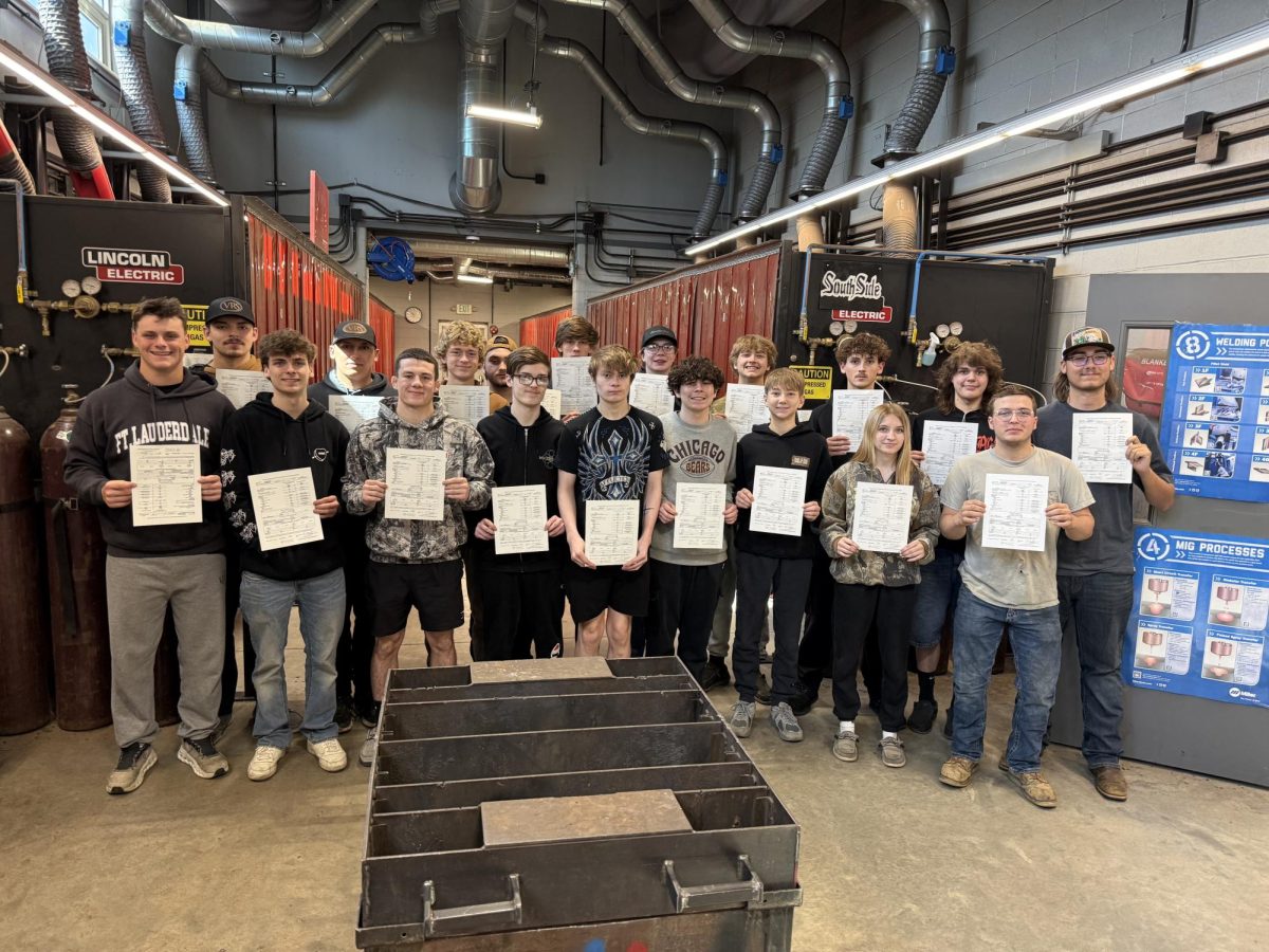 Lowell Welders pose after everyone passed their certification test