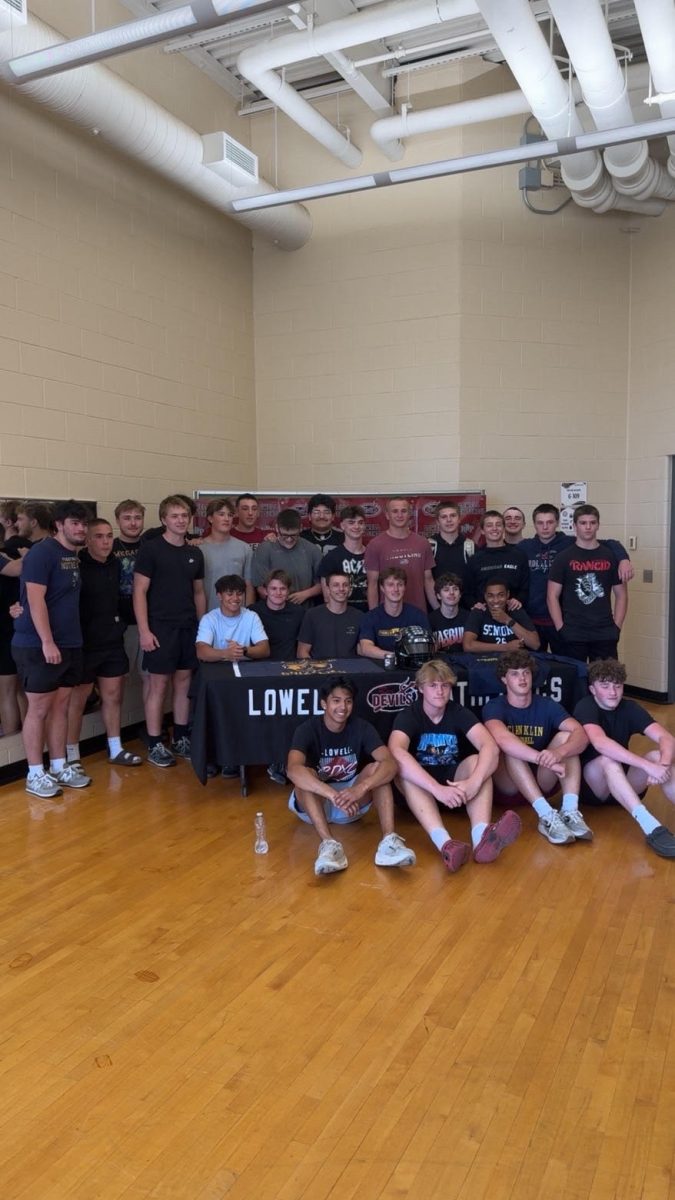 Brody signs with all his teammates.